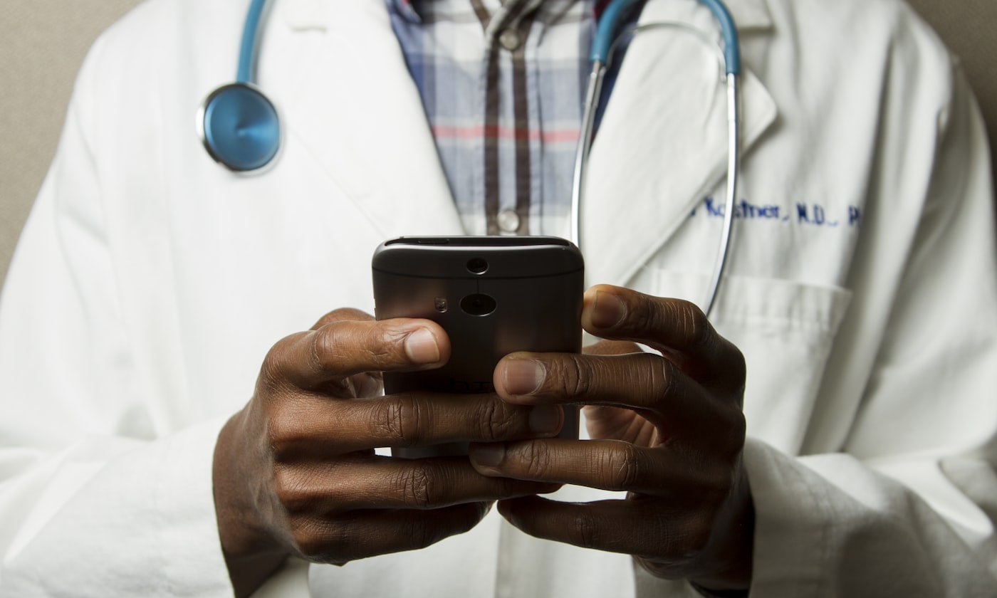 Clinician reviewing medical records on a tablet